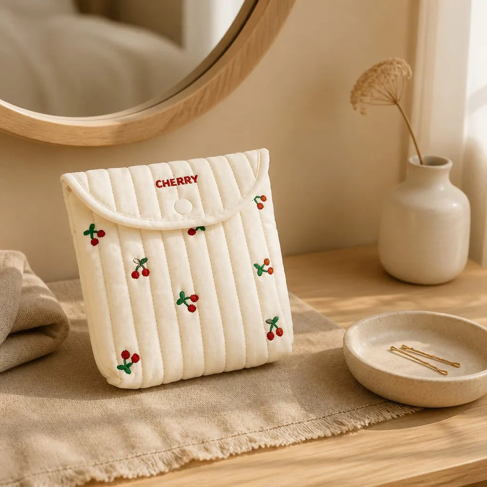 Halyvira quilted cherry storage pouch on a warm bedroom vanity