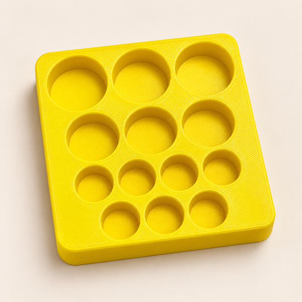 Custom yellow insert with thirteen mixed-size recesses — illustrative layout
