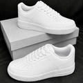 Pure white low-top casual sneakers on plain boxes