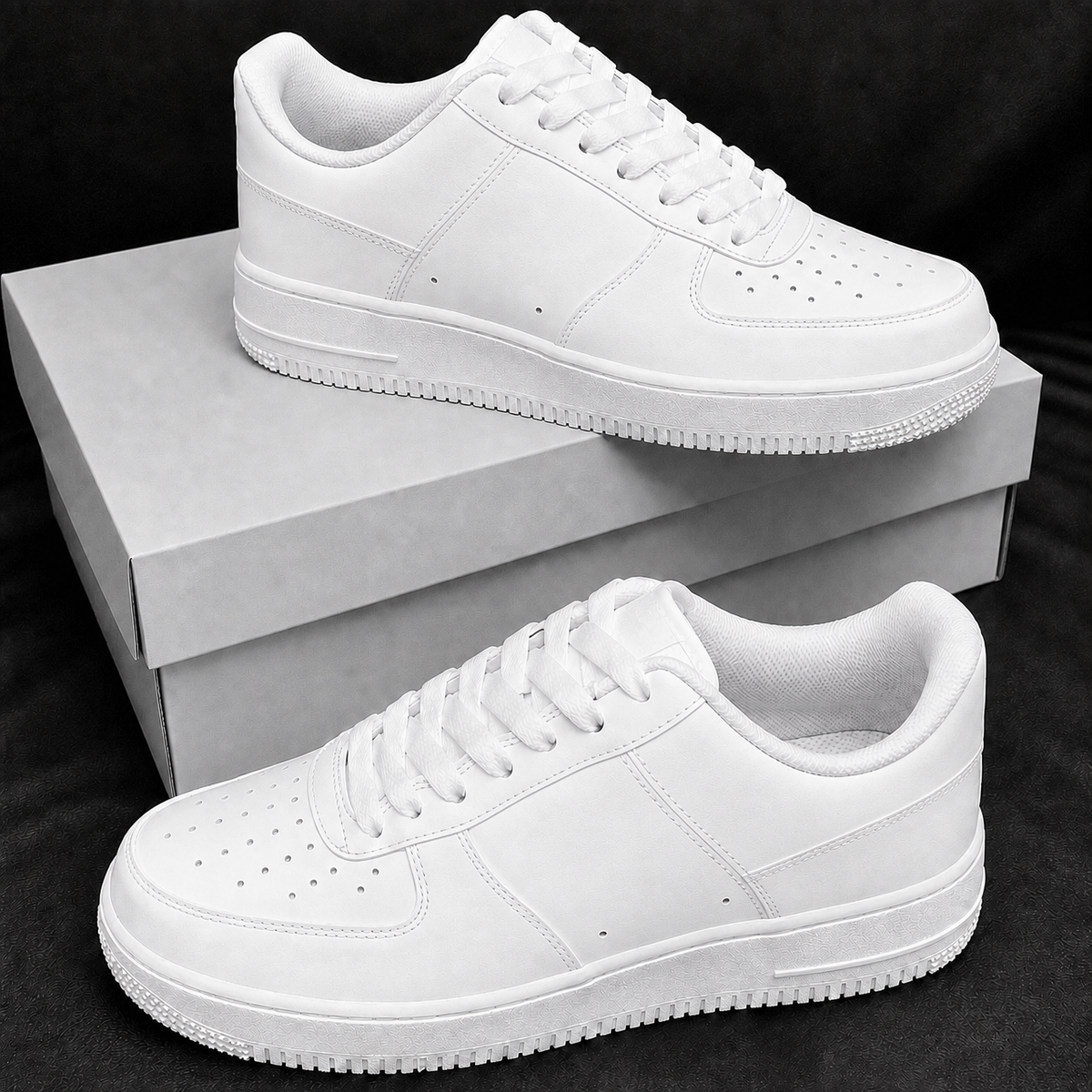 Pure white low-top casual sneakers on plain boxes